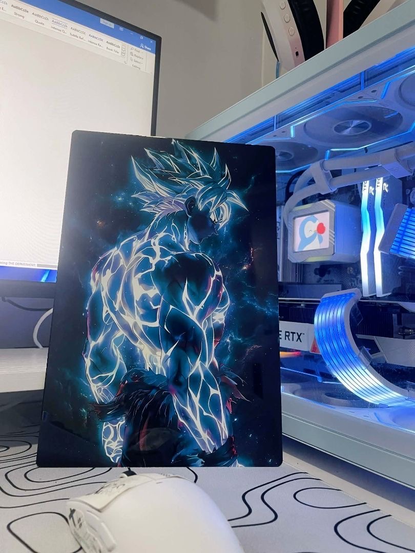 A Metalix anime print displayed beside a blue-lit PC setup